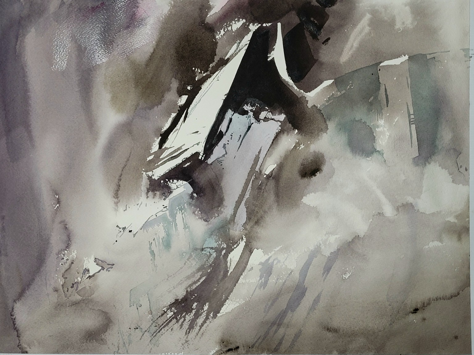 An abstract rock wall with angular dark forms and pale washes