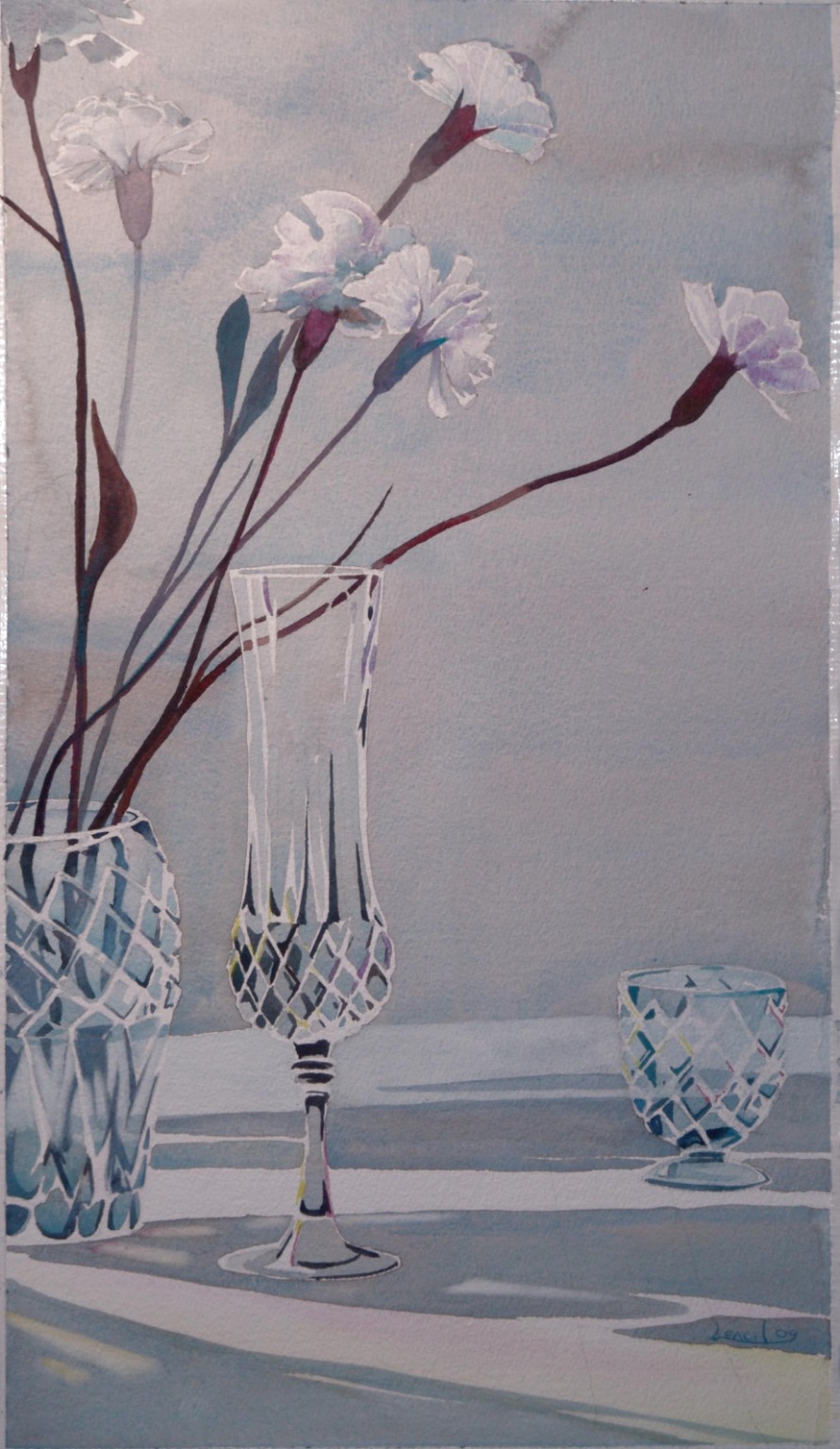 Flowers in tall crystal vases with a small crystal vessel